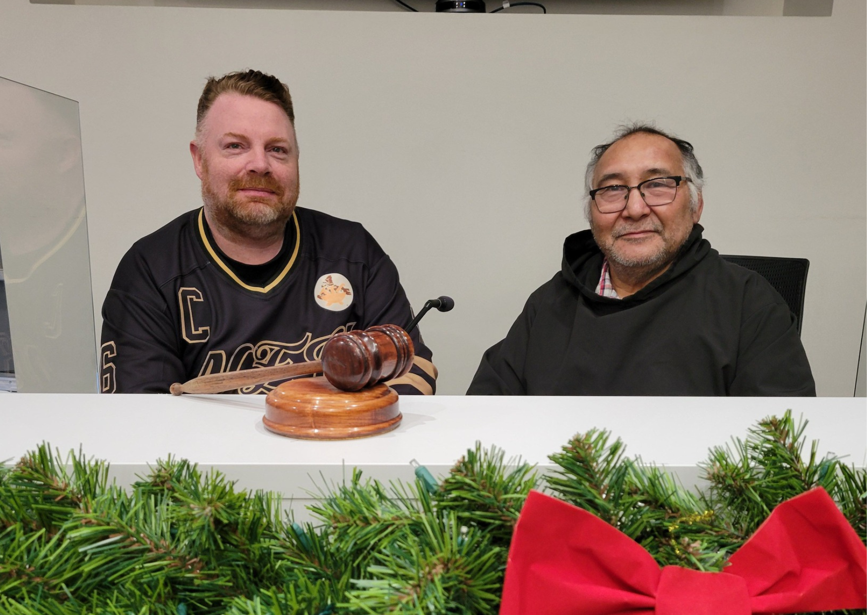 NEU President Jason Rochon and Iqaluit Mayor Solomon Awa meeting in council chambers on December 12